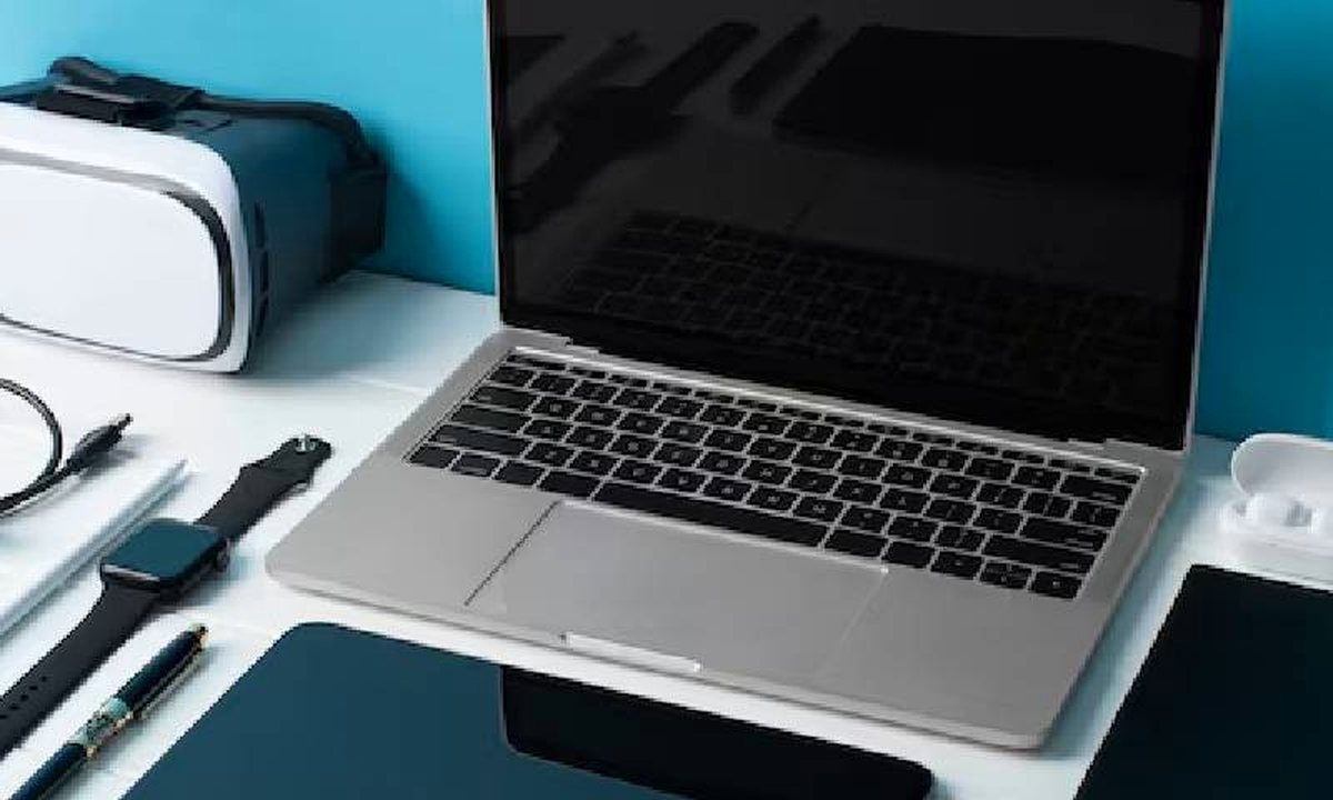 Laptop, tablet and VR headset on a desk